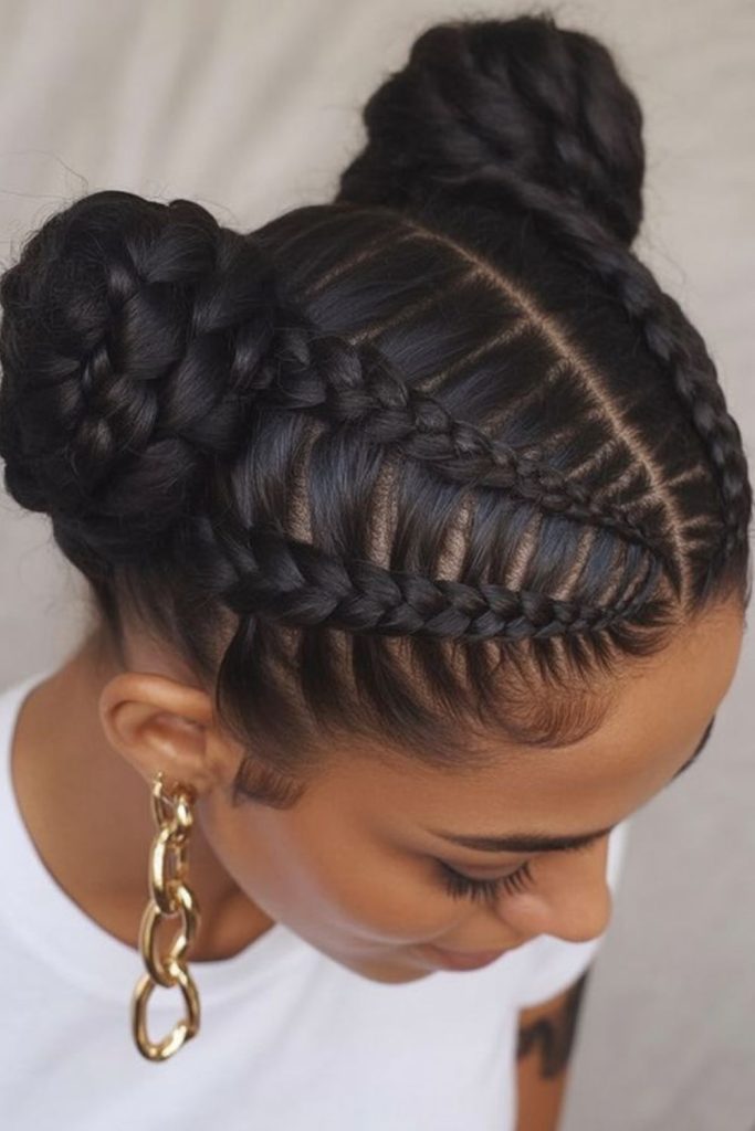 Space buns with natural cornrows hairstyle.