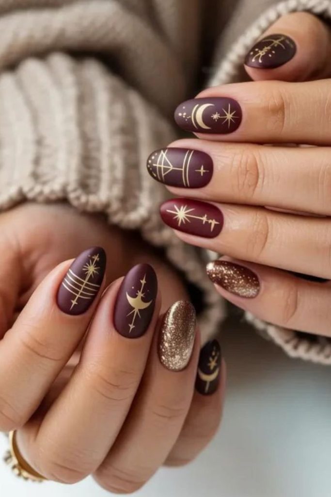 Cosmic burgundy lion queen nails