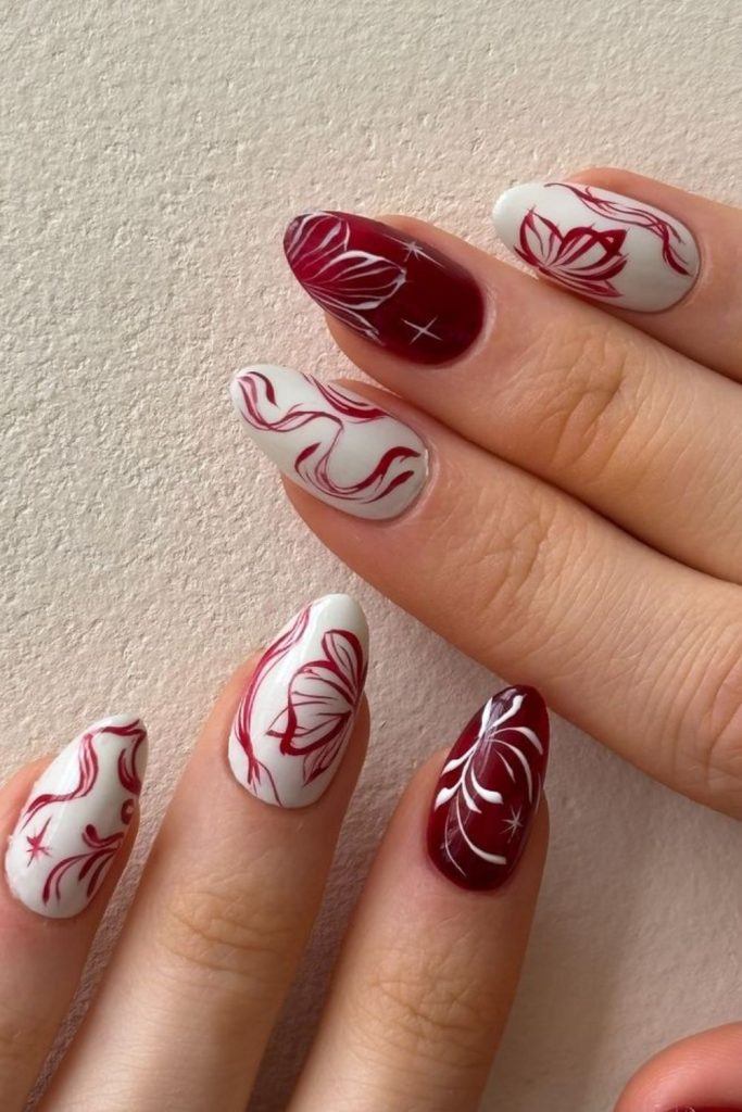 Crimson floral accent elegant nail design.