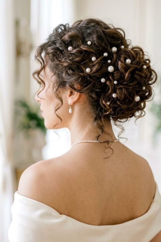 Curly knots adorned with jeweled pins.