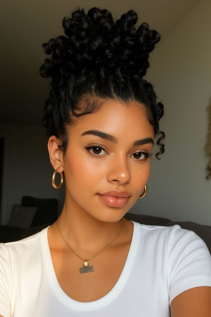 Curly pineapple pony school hairstyle.