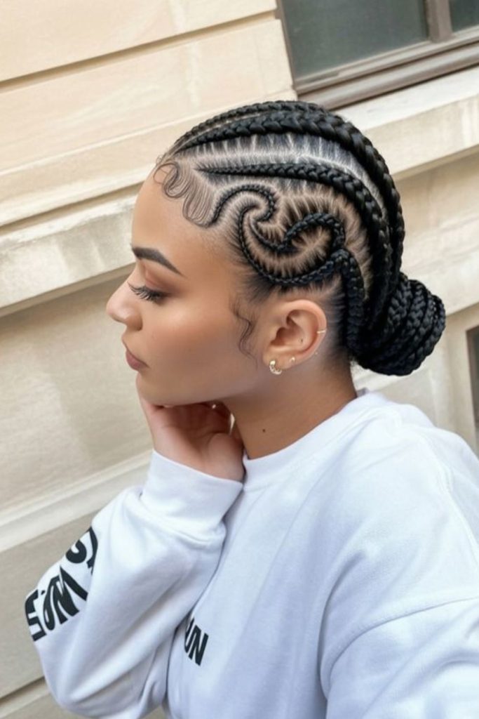 Artistic curved swirl cornrow design.