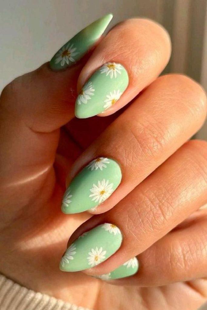 Sage green daisy floral nails.
