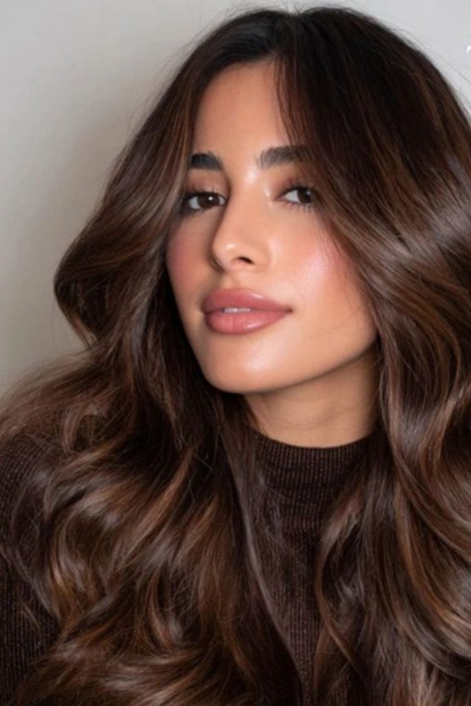 Dark chocolate hair with honey highlights.