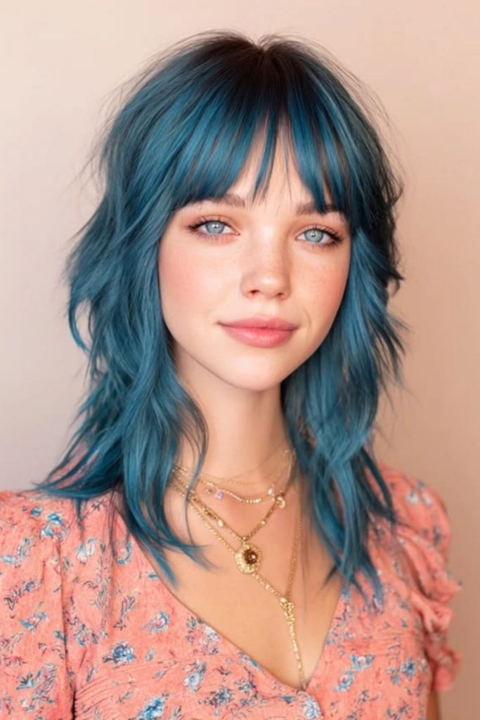 Electric blue wolf cut with bangs.