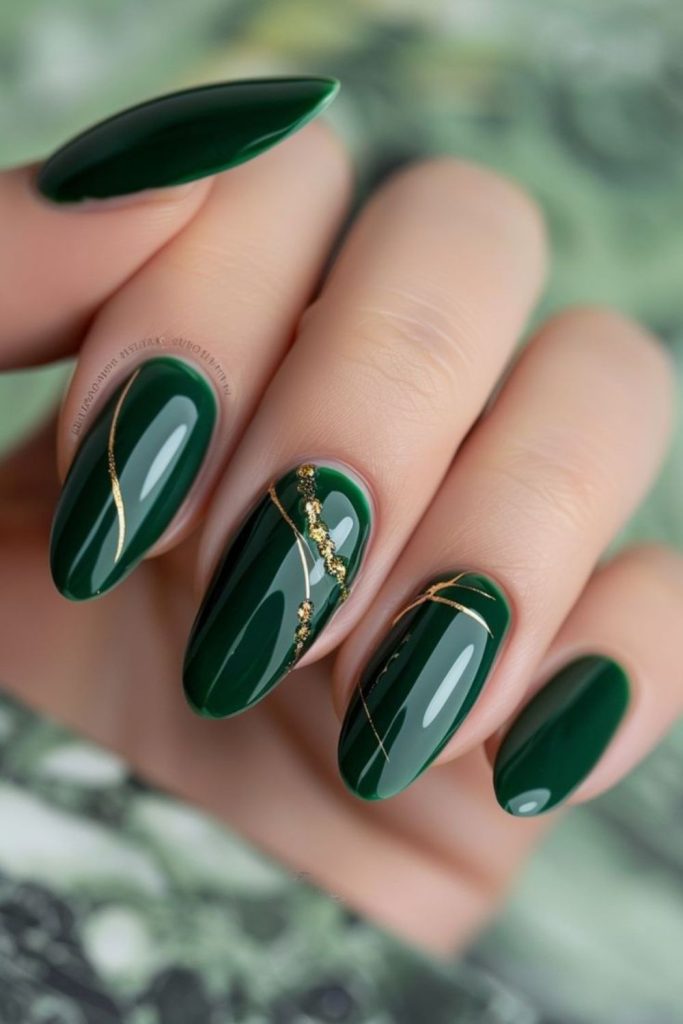 Emerald green nails with gold.