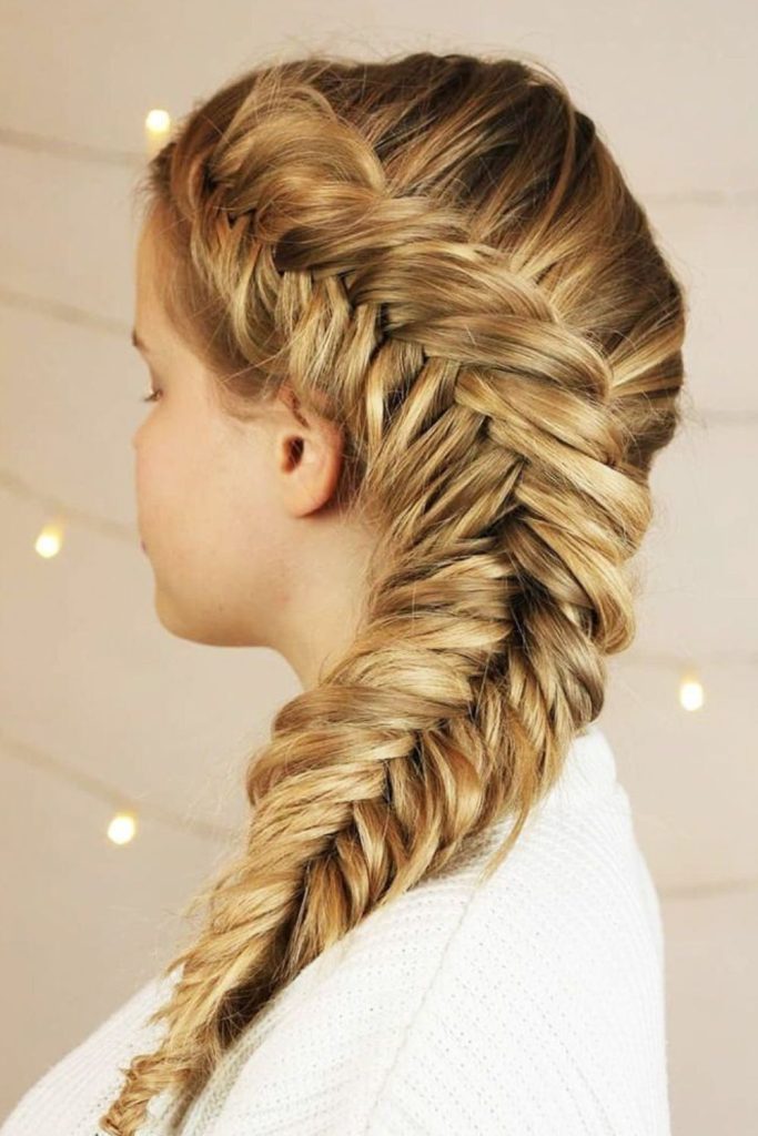 Side fishtail braid elegant hairstyle.