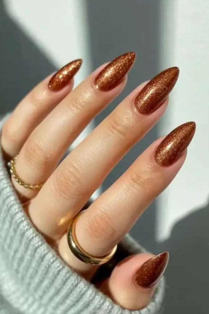 Golden honey glossy August nail design.