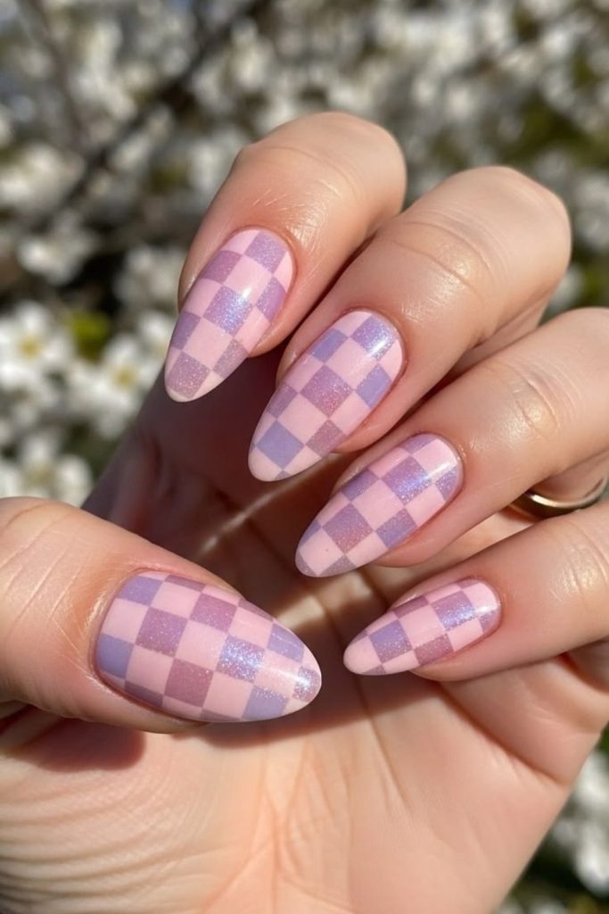 Pastel checkerboard nails with colorful patterns.
