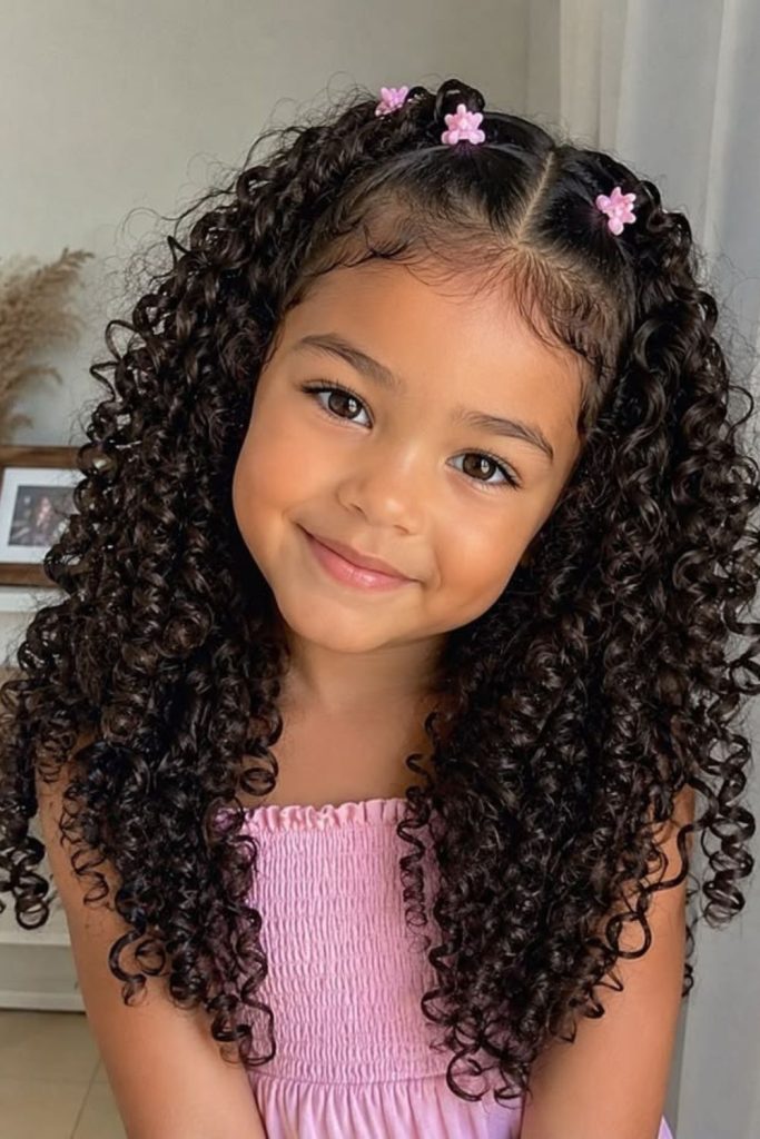 Half up mini bun curls.