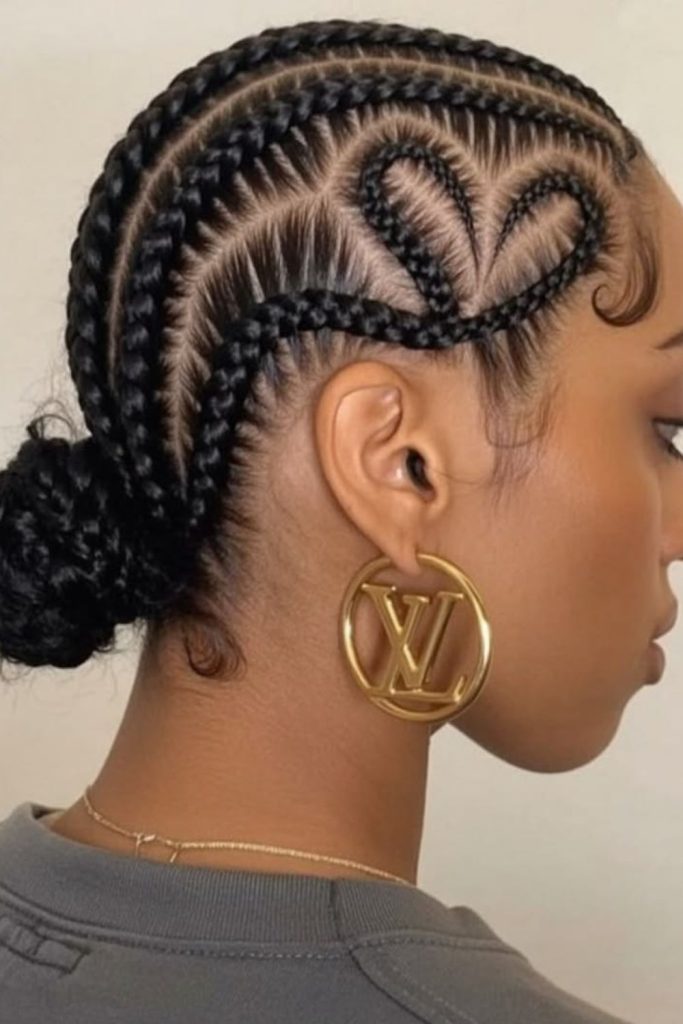 Creative heart patterned cornrow hairstyle.