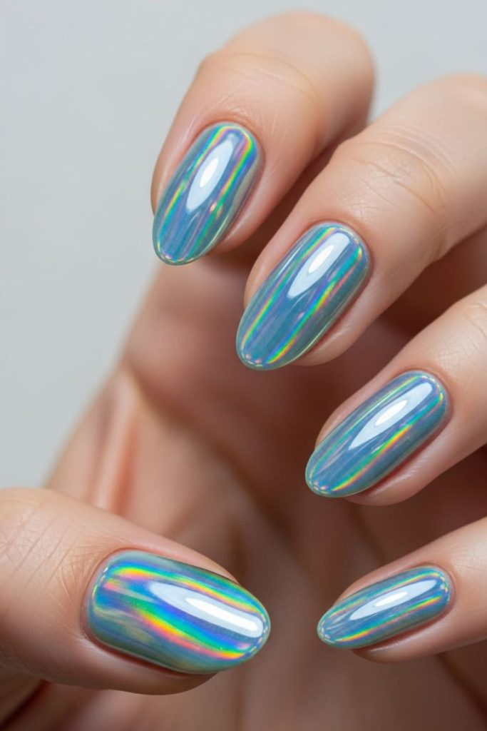Holographic chrome rainbow shimmer school nails.