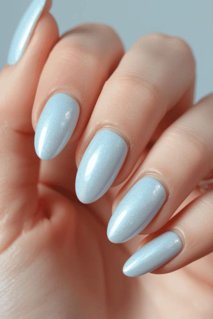 Ice blue crystal shimmer nail design.
