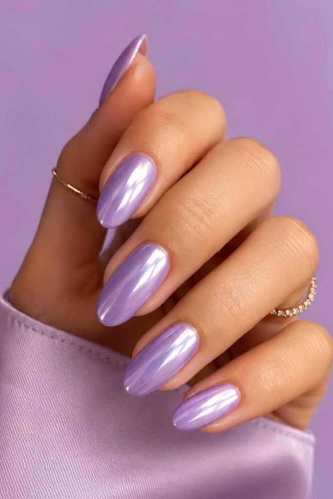 Lavender chrome nails with dreamy shine.