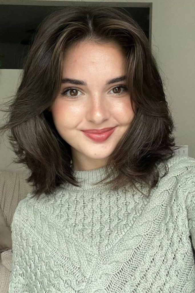 Layered short hair with volume.