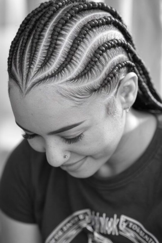 Leaf-inspired natural cornrow braids.