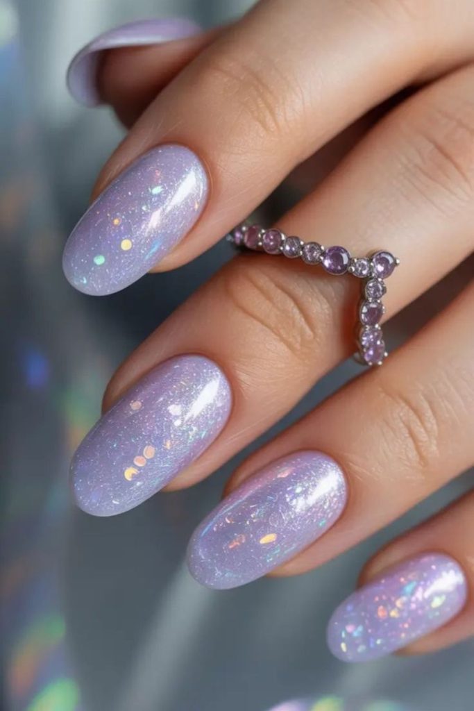 Lilac holographic glitter nail design.