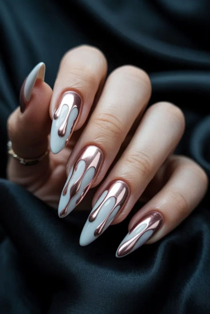 Liquid silver nails with metallic drips.