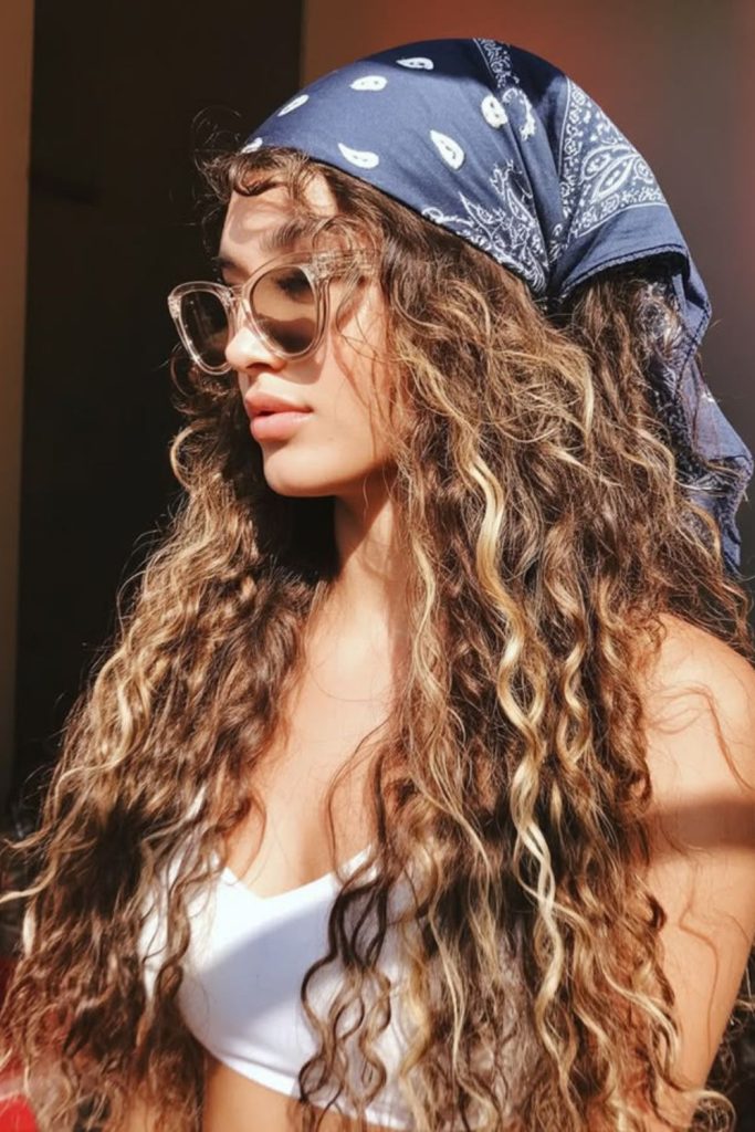 Loose curls with side-tied bandana.