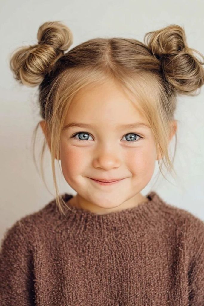 Messy space buns with glitter clips.