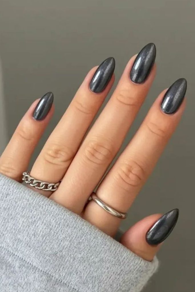 Metallic charcoal chrome almond nails.