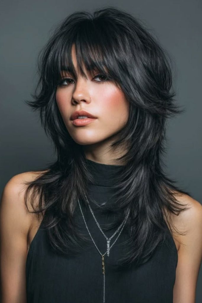 Midnight shag wolf cut with bangs.