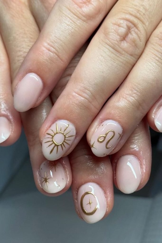 Minimal gold Leo symbol nails