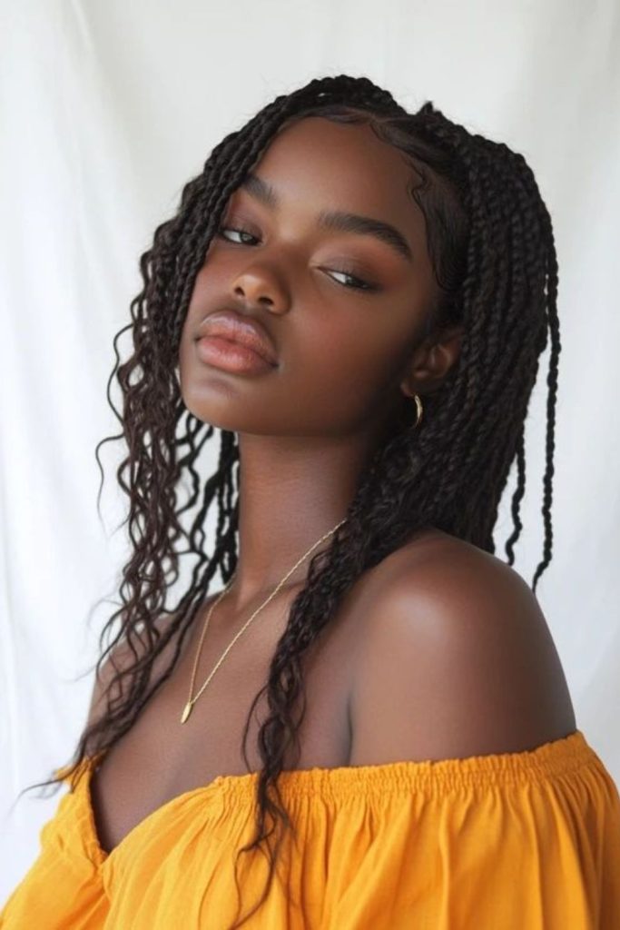 Thin goddess braids with curly accents.