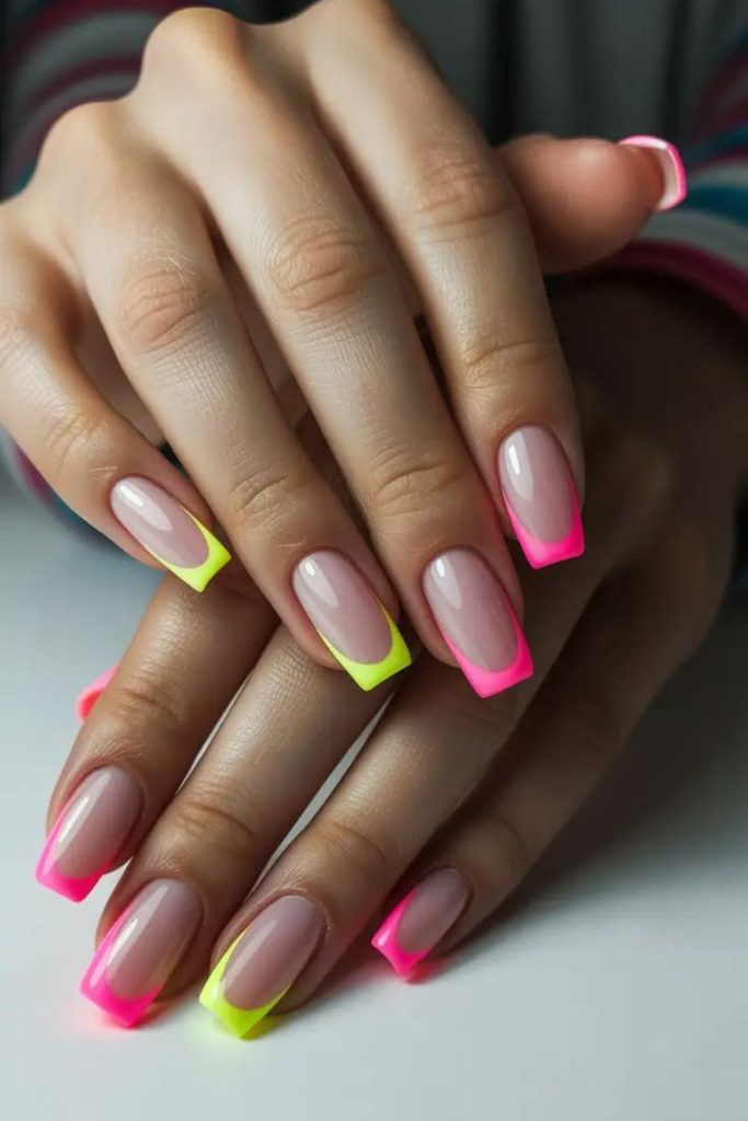 Neon French tips with colorful accents.