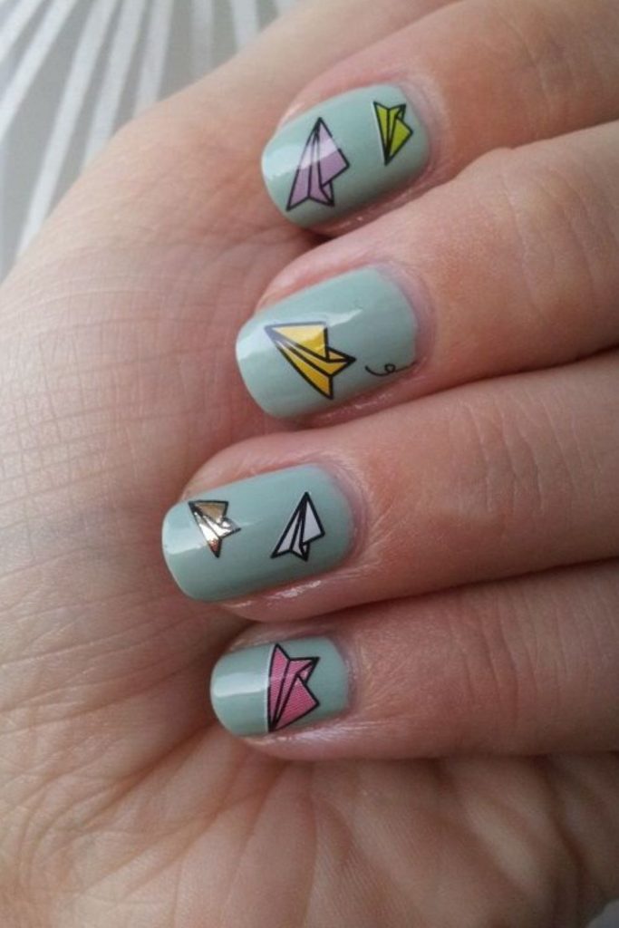 . Paper airplane inspired teacher manicure.