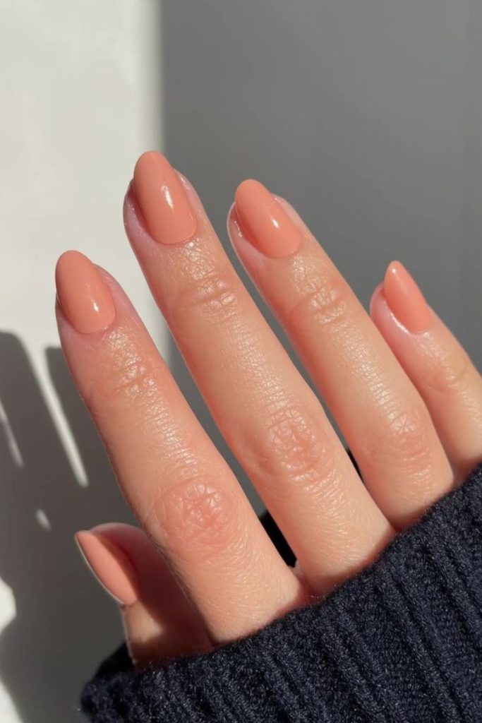 Soft peach glossy everyday nail design.
