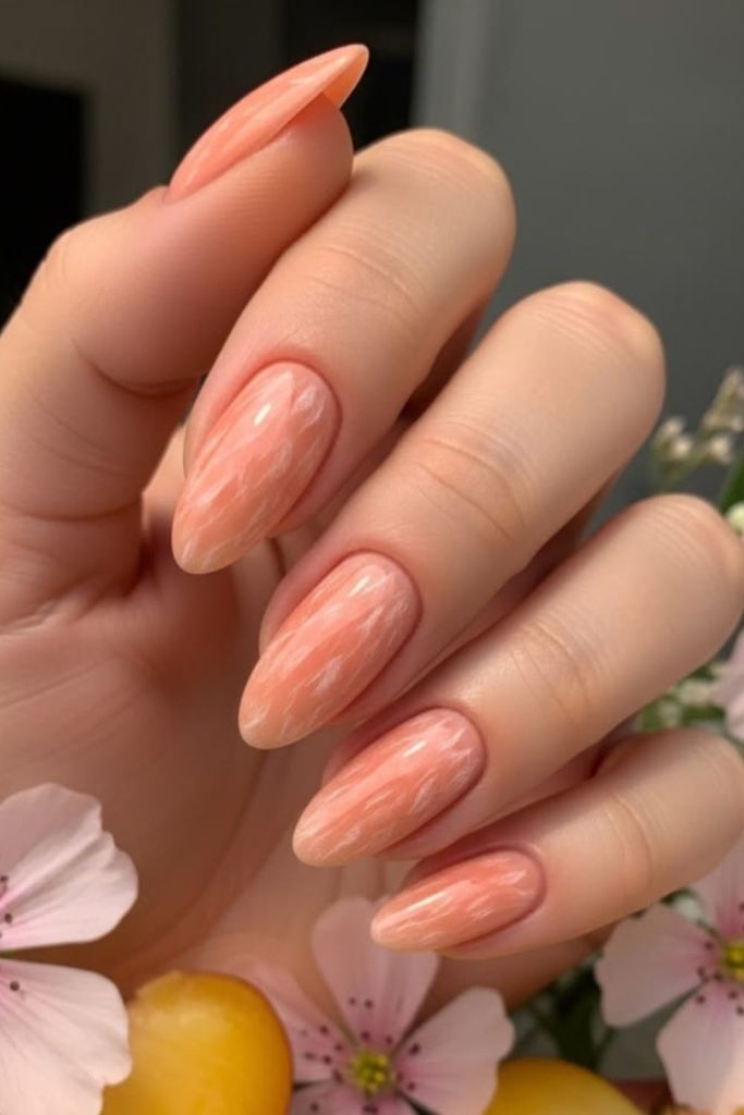 Soft peach orchard inspired manicure style.