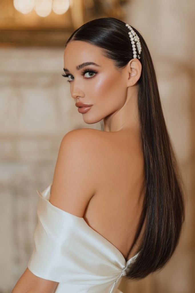 Straight hair with pearl side pins.