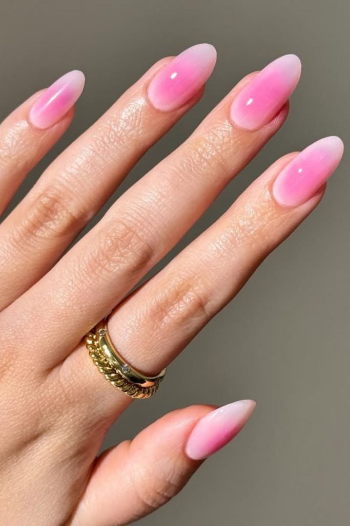 Soft pink aura nail design.