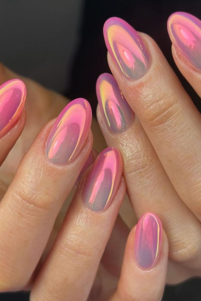 Pink chrome mirror finish nail design.
