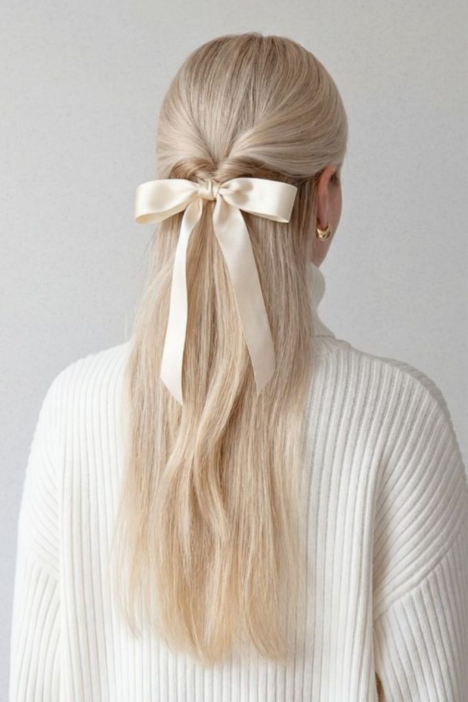 Platinum ribbon sleek straight hairstyle.
