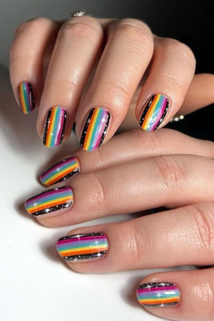 Pastel rainbow notebook line nail design.