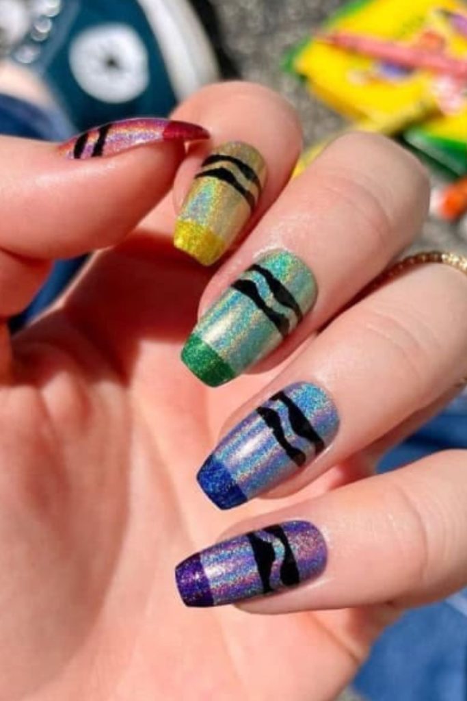 Colorful pencil inspired classroom nail design.