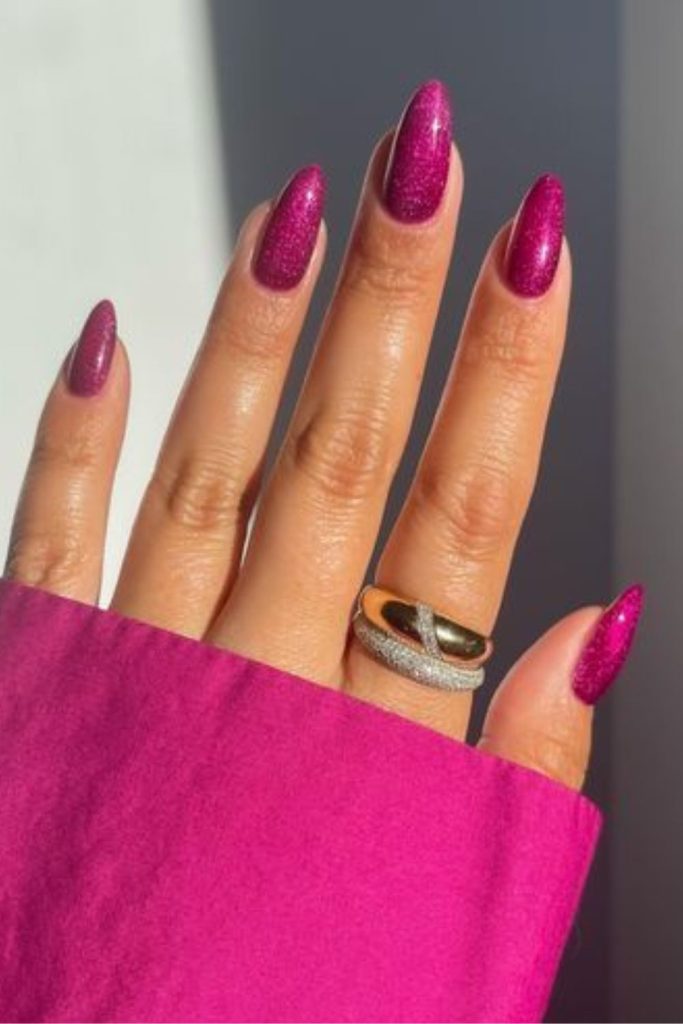 Raspberry glitter glossy evening nail style.