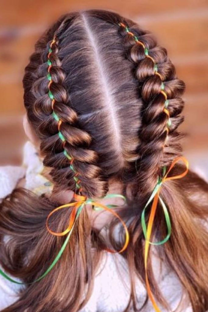 Ribbon braided cascade long hairstyle.