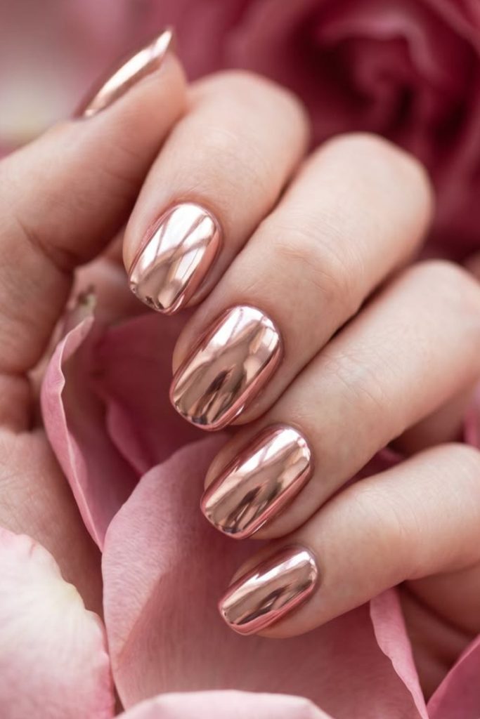 Rose gold glamorous nude nail design.