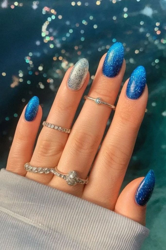 Sapphire blue shimmering ocean nail design.