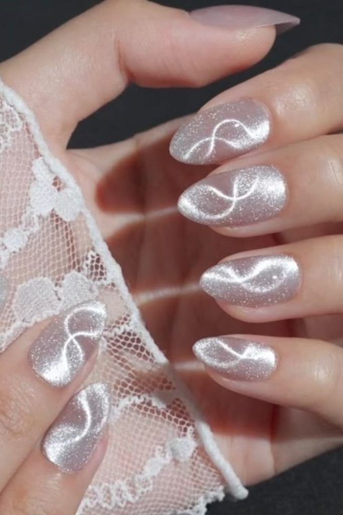 Silver ribbon blush pink nail design.