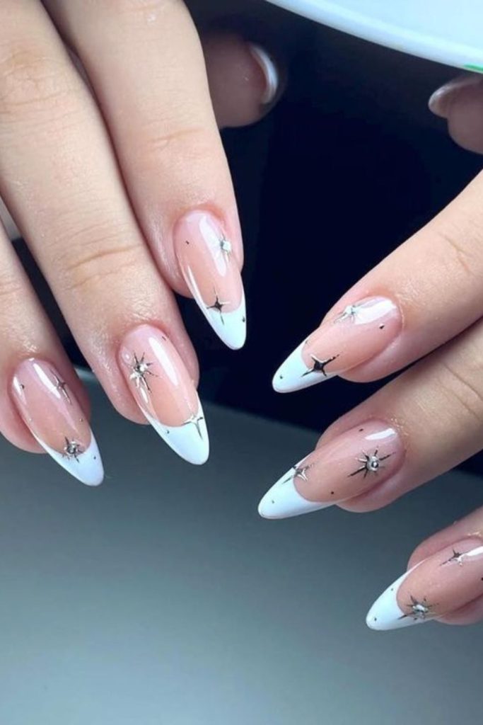 Silver French nails with tiny stars.