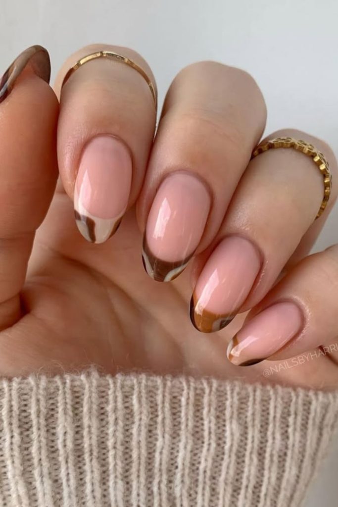 Golden sunburst French tip nails