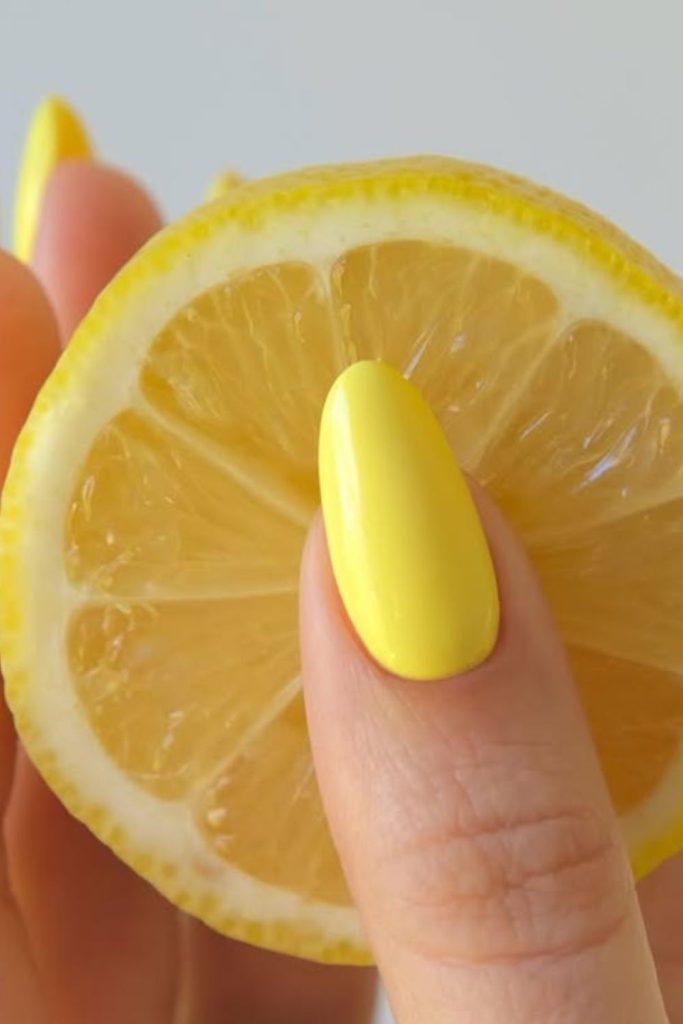 Bright lemon yellow cheerful nail design.