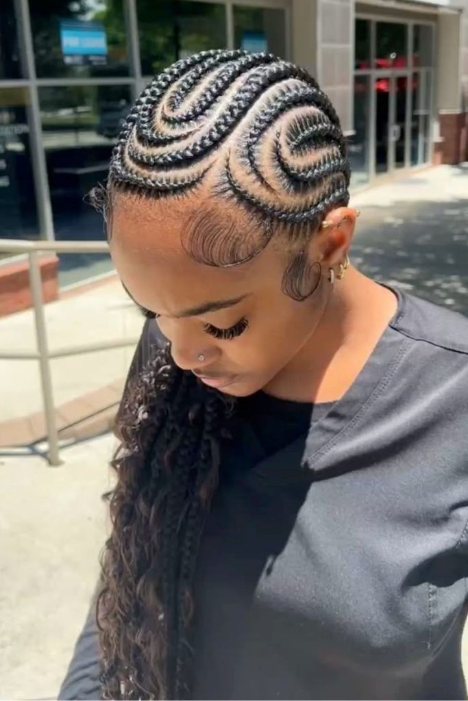 Swirling natural cornrow braid design.