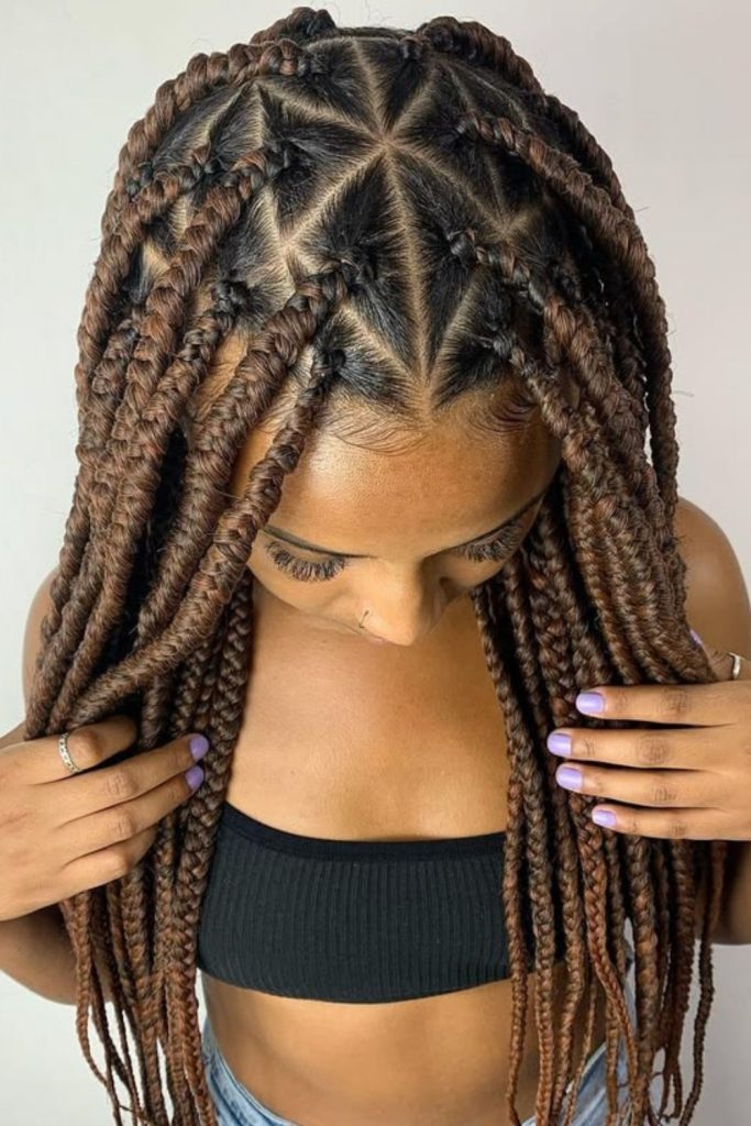 Triangle part sleek natural cornrows hairstyle.