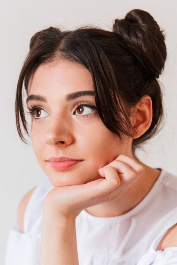 Cute twin space buns hairstyle.