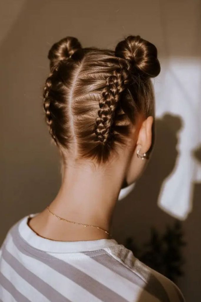 Twisted double buns with accessories.
